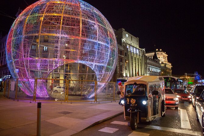 Christmas Lights Tour of Madrid in Eco Tuk Tuk Private - Start at Retiro: how the private tuk-tuk night sets you up
