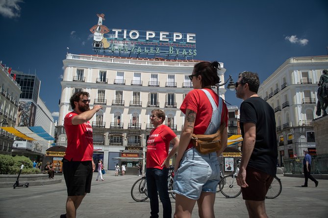 Madrid: 3 hour Guided Highlights Bike Tour with Optional Tapas - Puerta del Sol and the 0 km Point: Madrid’s Center of Attention