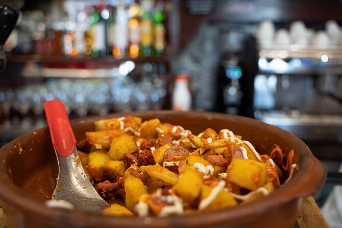 Madrid by Night: Tapas Crawl, Local Drinks & Hidden Gems - Puerta del Sol finish: dessert, directions, and a full stomach