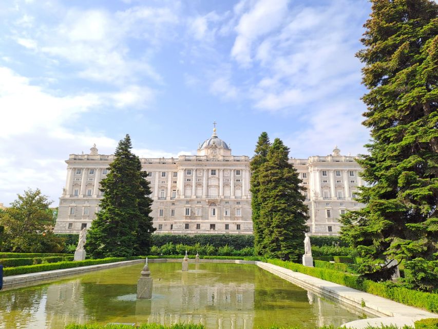 Madrid: City Highlights Guided Walking Tour - Almudena Cathedral Exterior Gothic Meets Royal Power Next Door
