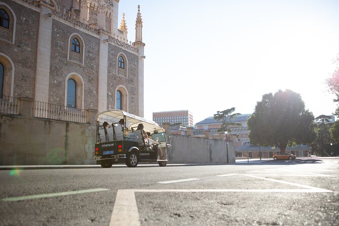 Madrid Express Tour with Local Guide in Eco Tuk Tuk Private - Atocha Station: the busiest hub that still feels human