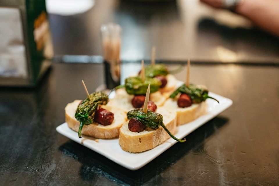 Madrid: Guided Tapas Tour with Tastings and Drinks - Stop 1: a market-style cuisine restaurant where you start strong