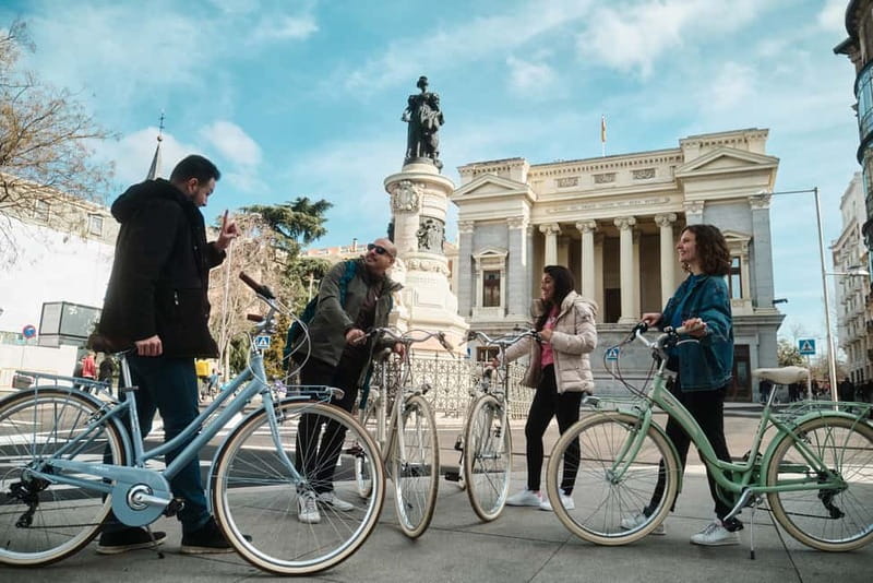 Madrid: Highlights Guided Vintage Bike Tour and Tapas Option - Las Letras and Puerta del Sol: start in character, not in traffic