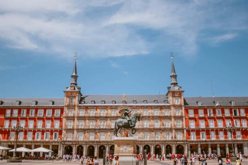 Madrid: Old Town, Poets District, and Royal Palace Tour - Santa Ana, Jacinto Benavente, and Puerta del Sol: the plazas that anchor the city