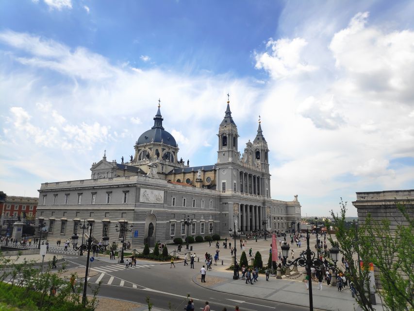 Madrid: Royal Palace and Almudena Cathedral Small-Group Tour - Crossing Plaza de la Armería to Almudena Cathedral