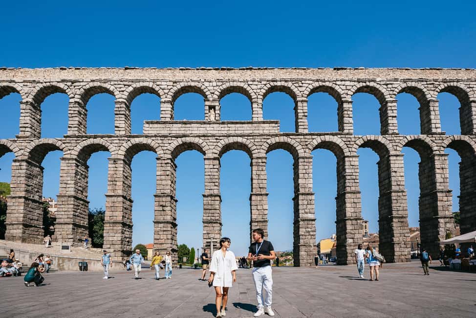 Madrid: Toledo & Segovia Full Day Guided Tour with Alcázar - Segovia First Look: Roman Aqueduct and a Cathedral Stop